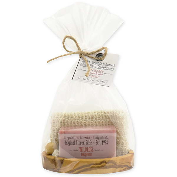 Cold-stirred soap 100g in cellophane on a olivewood soap dish with the label, Wild rose with petals 