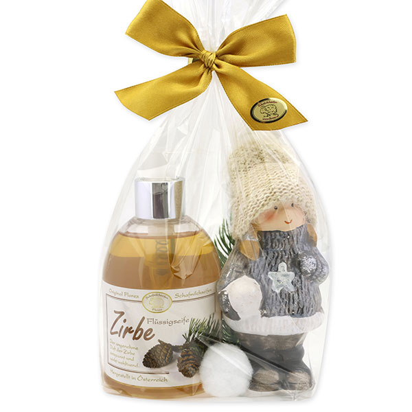 Liquid soap 250ml with a ceramic-winter child in a cellophane bag, Swiss pine 