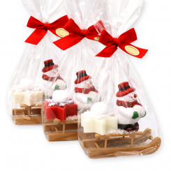 Schafmilchseife Stern midi 20g dekoriert mit Schneemann auf Holzschlitten in Cello, sortiert 